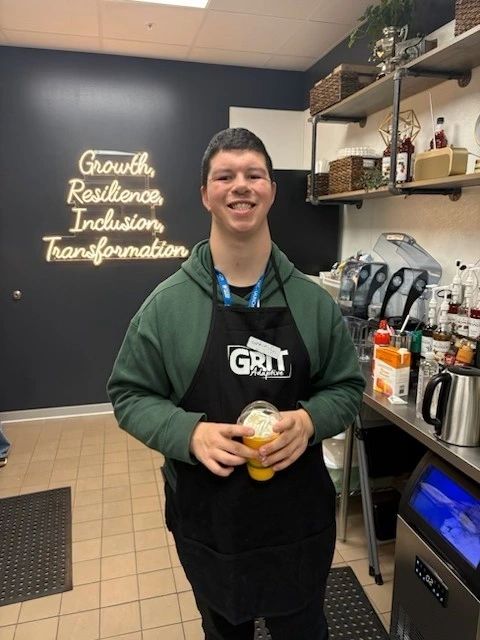 Cafe Grit staff smiling at the counter